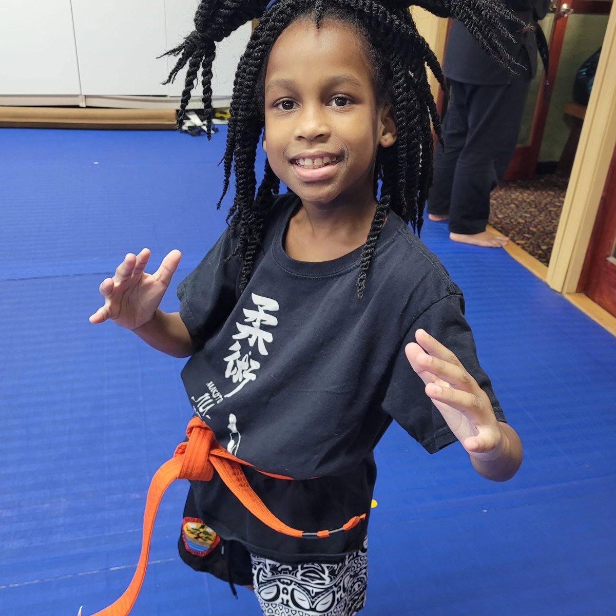 A Is Your Child student smiling proudly after class at Makoto Jiu Jitsu Centers in Deer Park
